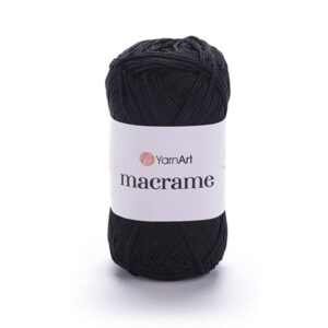 Photo pelote macrame noir placée devant avec belle texture