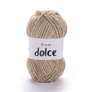 Zoom sur pelote Dolce beige positionnée au premier plan